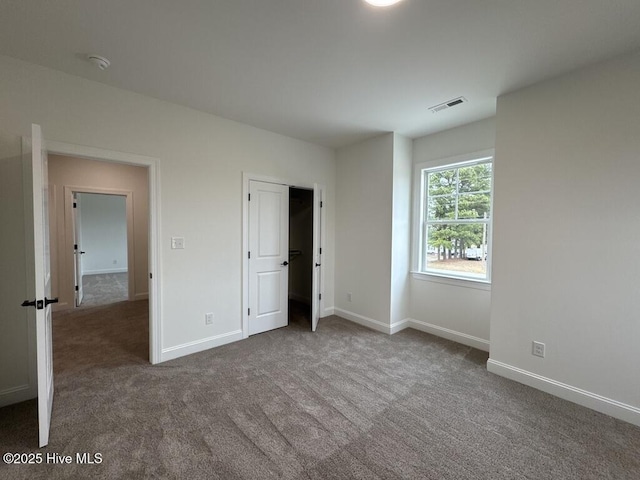 4158 Dixon Rd, Grimesland, NC 27837 - unfurnished bedroom featuring visible vents, baseboards, and dark colored carpet