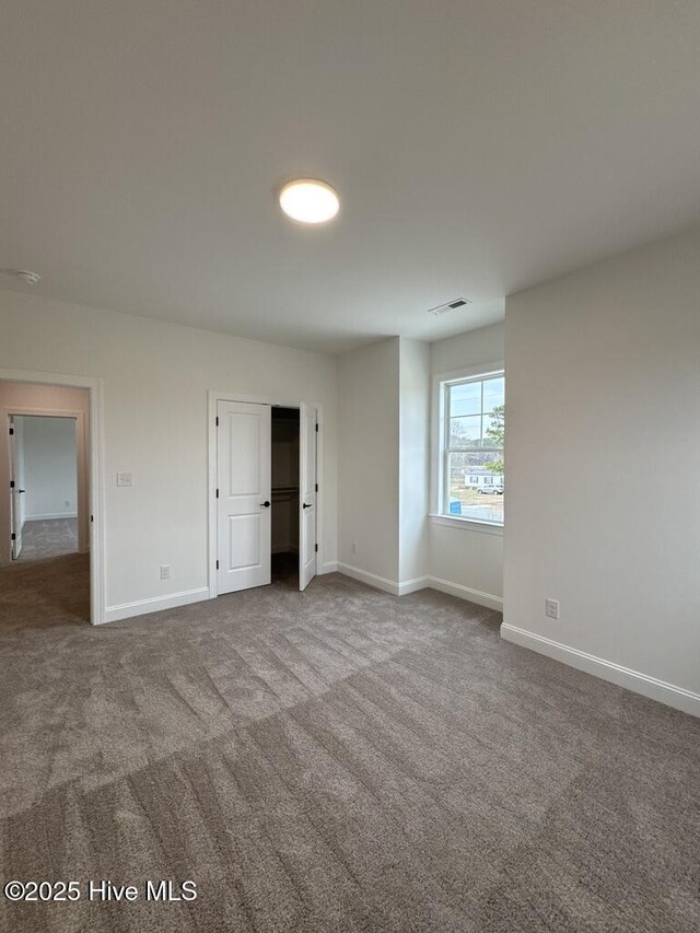 4158 Dixon Rd, Grimesland, NC 27837 - unfurnished bedroom with carpet, visible vents, and baseboards