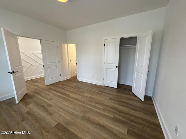 4158 Dixon Rd, Grimesland, NC 27837 - unfurnished bedroom featuring dark wood-style floors, baseboards, and a closet