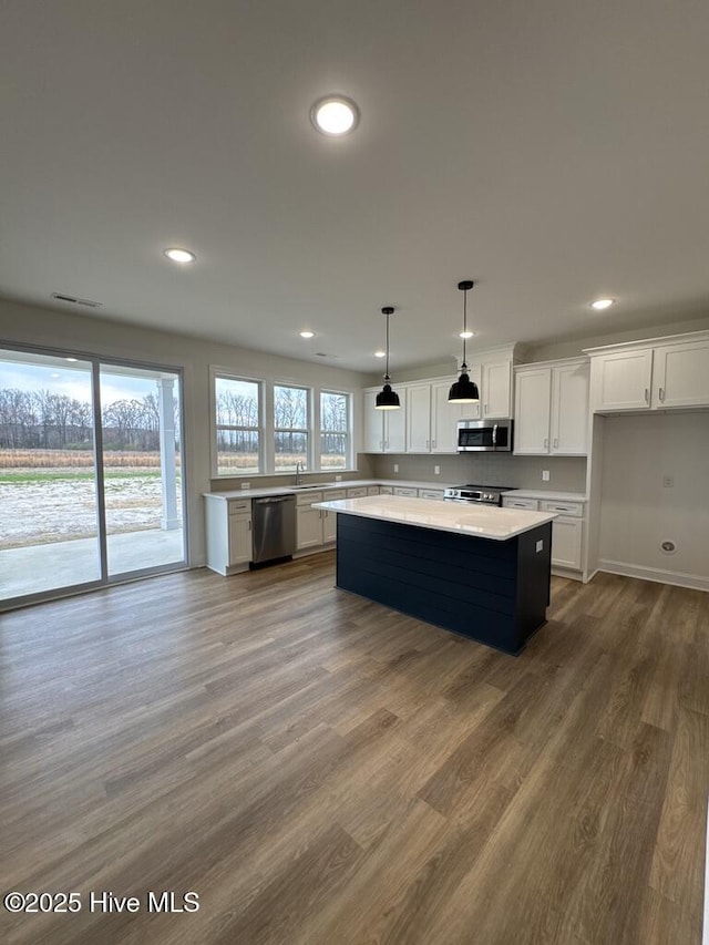 4158 Dixon Rd, Grimesland, NC 27837 - kitchen with a sink, stainless steel dishwasher, tasteful backsplash, white cabinetry, and light countertops