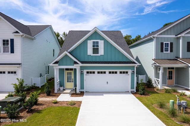 view of front of house with a front yard and a garage