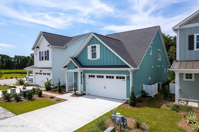 craftsman-style house with a front lawn and a garage