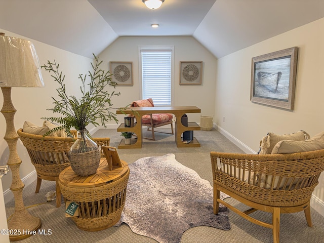 sitting room featuring lofted ceiling and light colored carpet