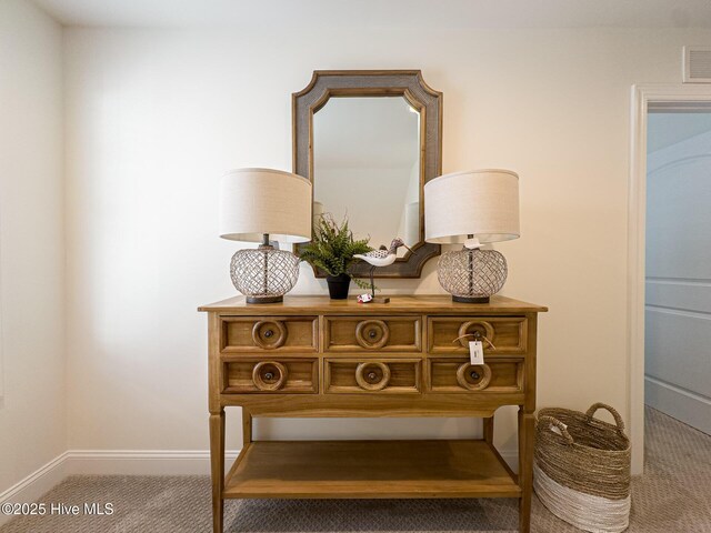 living area featuring crown molding