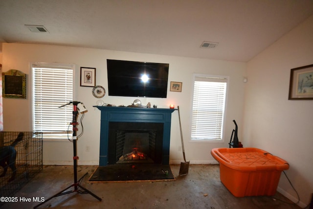 living room featuring lofted ceiling