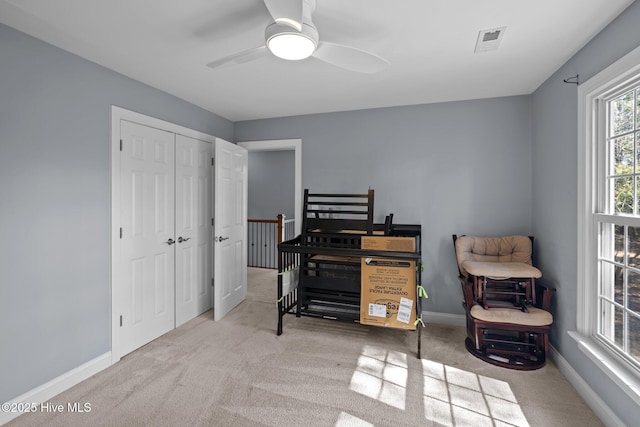 bedroom with carpet floors, a closet, visible vents, and baseboards