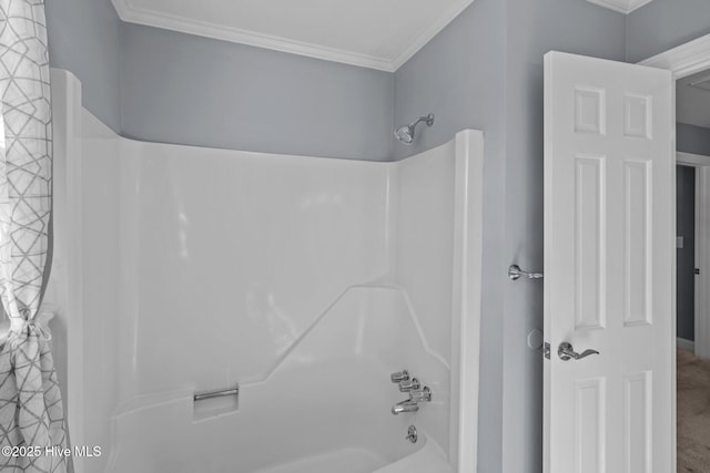 bathroom featuring bathtub / shower combination and crown molding