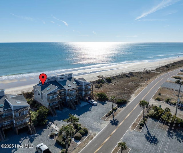 bird's eye view featuring a beach view and a water view