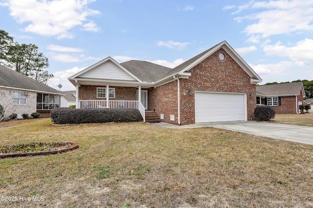 view of front of house with covered porch, a front lawn, and a garage