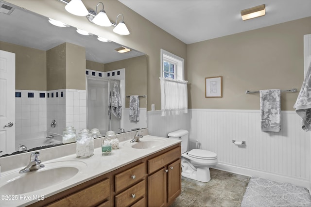 bathroom featuring toilet, a bathing tub, and vanity