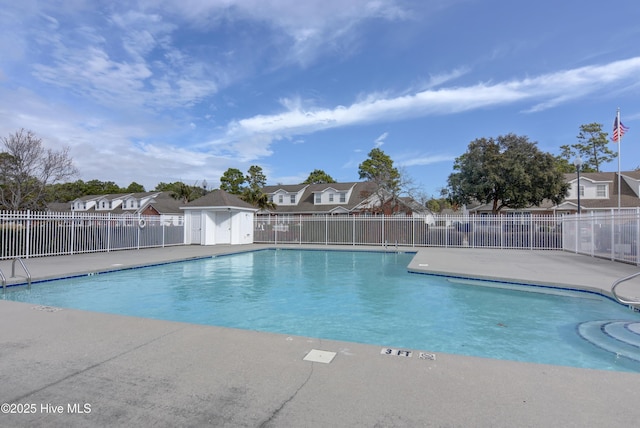 view of swimming pool with a patio