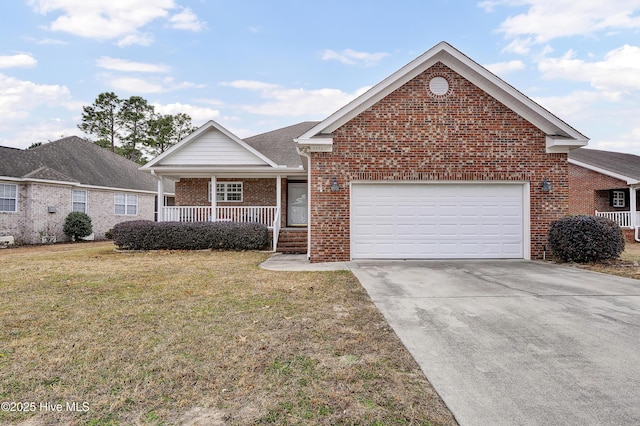 front of property featuring a front yard, covered porch, and a garage