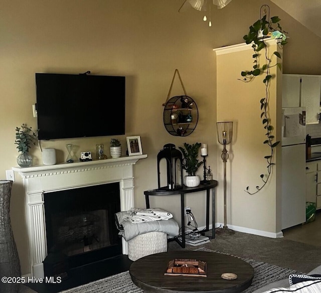 living room featuring lofted ceiling and ceiling fan