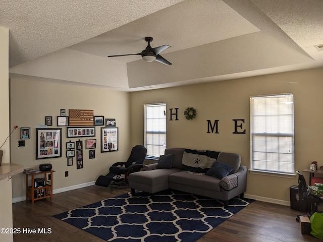 dining space with dark hardwood / wood-style floors and a textured ceiling