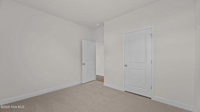 unfurnished bedroom with light colored carpet