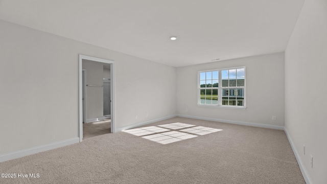 empty room with light colored carpet