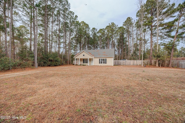 view of front of house with a porch and a front yard