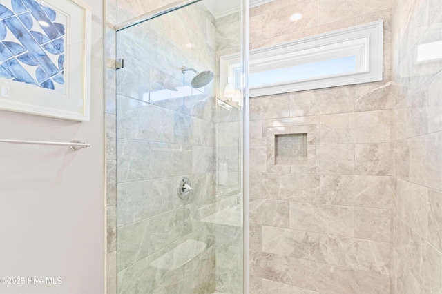 bathroom with a shower with shower door