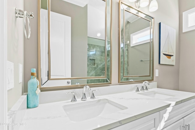 bathroom featuring vanity and ornamental molding