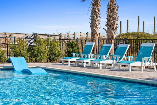 view of swimming pool with a patio