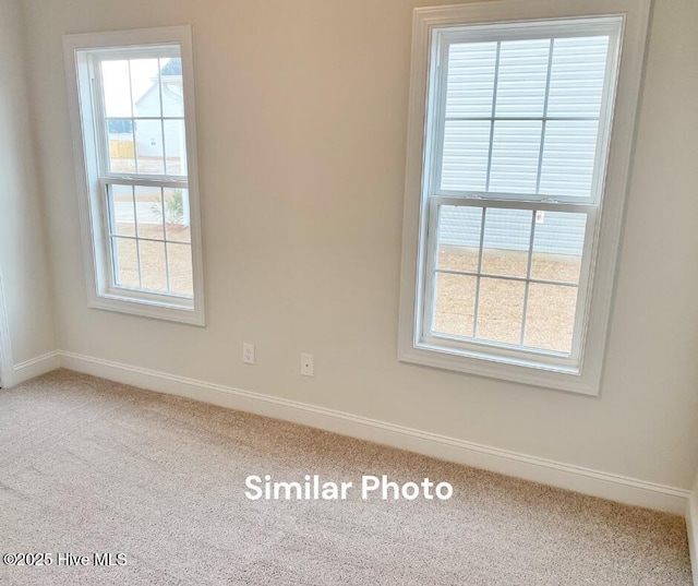 empty room with carpet flooring