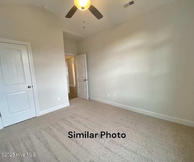 unfurnished bedroom featuring light carpet and ceiling fan