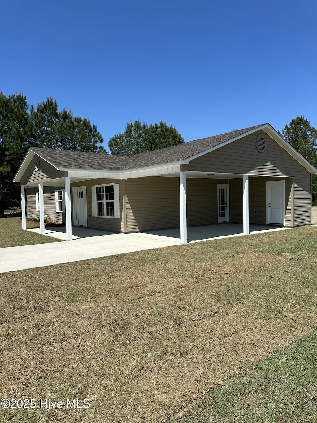 ranch-style home featuring a patio area and a front lawn