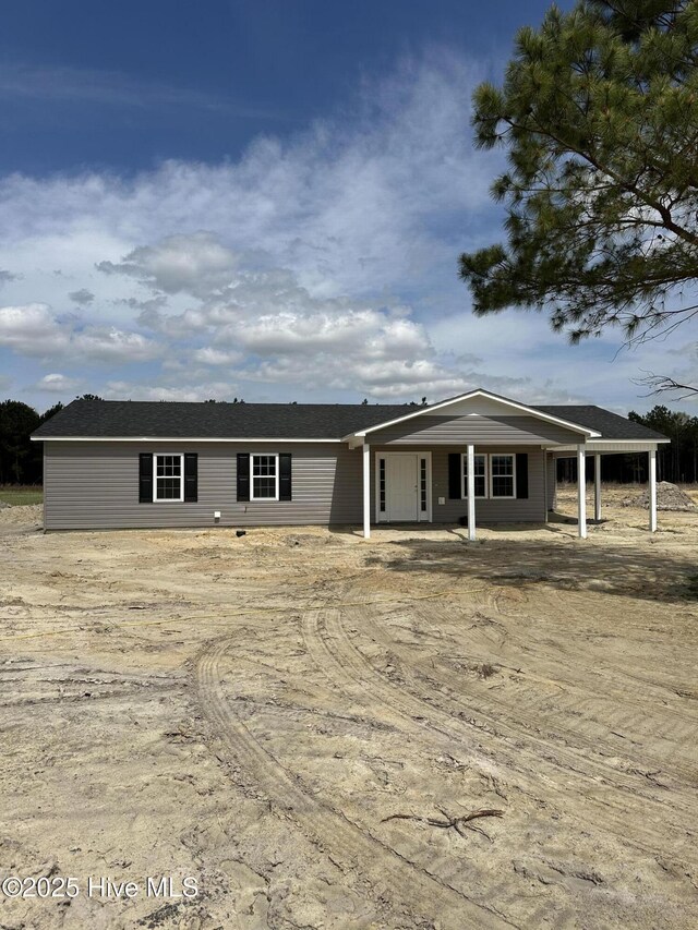 ranch-style home featuring a patio area and a front lawn