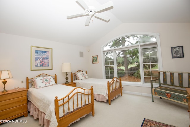 bedroom with lofted ceiling, ceiling fan, and carpet