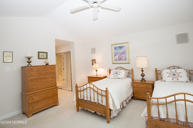 bedroom featuring vaulted ceiling, ceiling fan, and light carpet