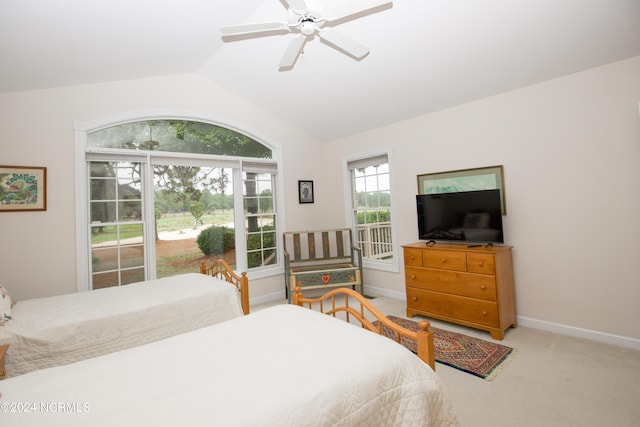 carpeted bedroom featuring vaulted ceiling and ceiling fan