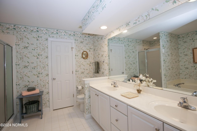 full bathroom featuring independent shower and bath, tile patterned flooring, vanity, and toilet