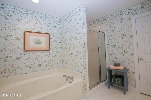 bathroom with separate shower and tub and tile patterned floors