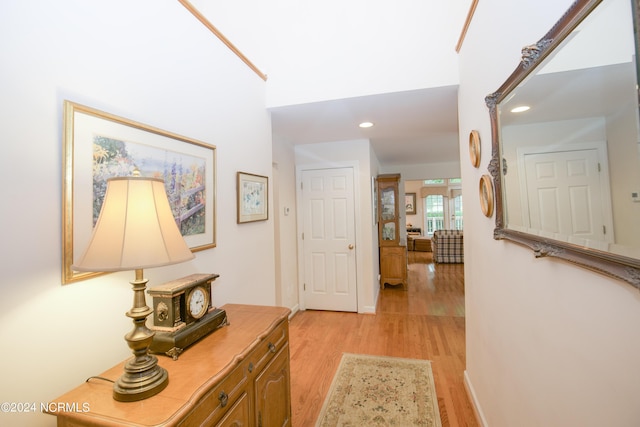 hall with light hardwood / wood-style flooring