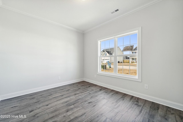 unfurnished room with crown molding and dark wood-type flooring