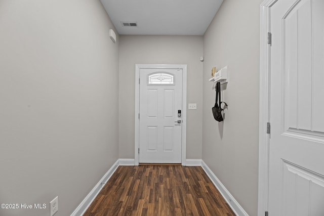 doorway featuring dark wood-type flooring