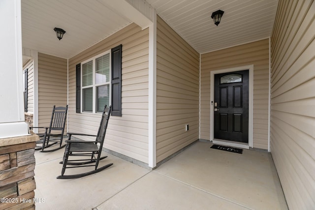 doorway to property with covered porch