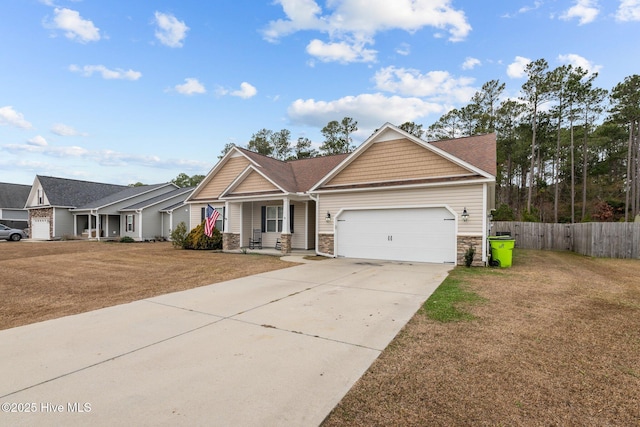 view of front of home featuring a front lawn and a garage