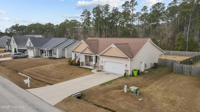 view of front facade with central air condition unit, a front lawn, and a garage