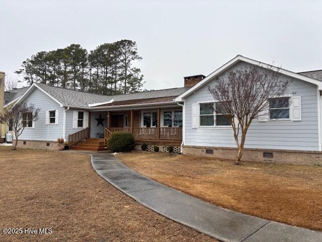 single story home with a porch, a front yard, crawl space, and central AC unit