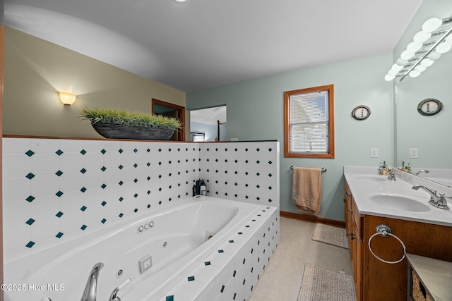 bathroom featuring a relaxing tiled tub and vanity