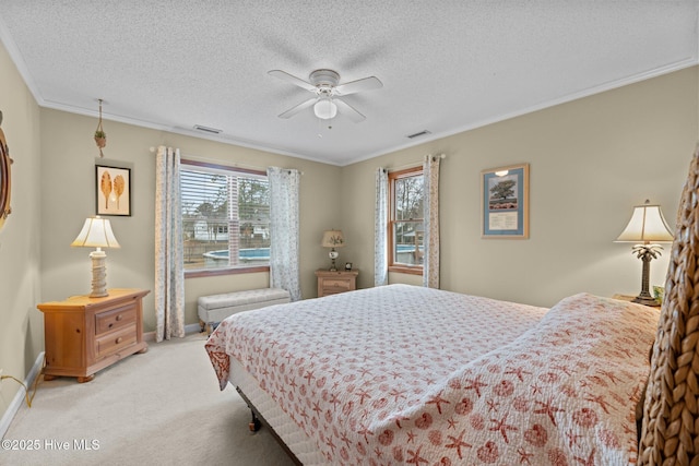 bedroom with multiple windows, crown molding, and ceiling fan