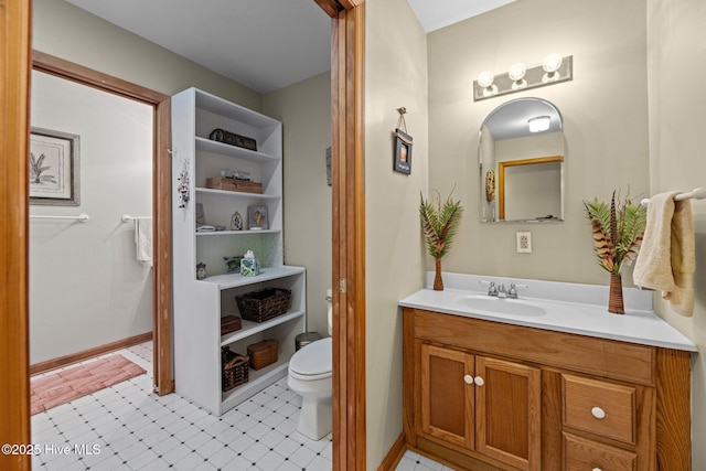 bathroom with vanity and toilet