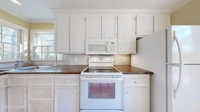 kitchen with white cabinetry, white appliances, sink, and backsplash