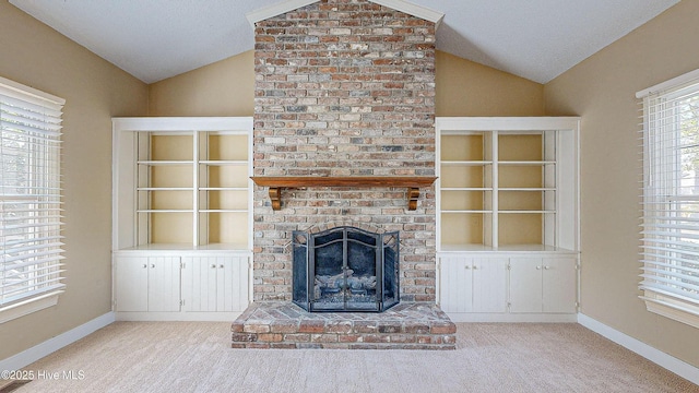 unfurnished living room featuring light carpet, a brick fireplace, vaulted ceiling, and a textured ceiling