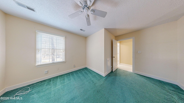 unfurnished room with ceiling fan, carpet floors, and a textured ceiling