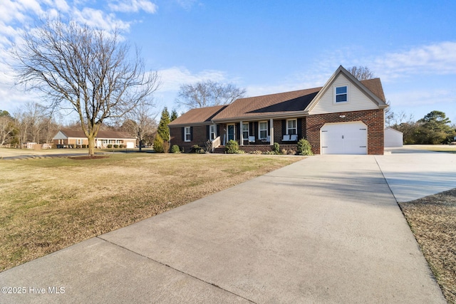 view of front of home with a front yard and a garage