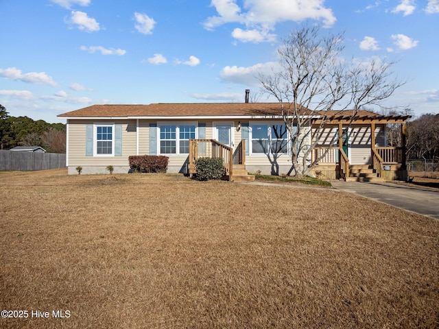 ranch-style home featuring a front yard