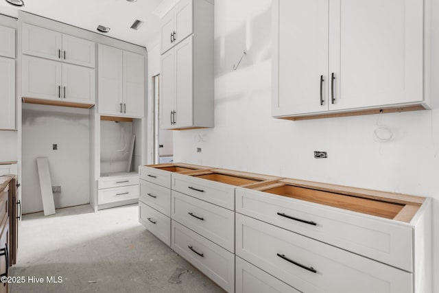 kitchen featuring white cabinetry