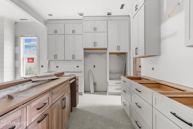 kitchen featuring white cabinetry